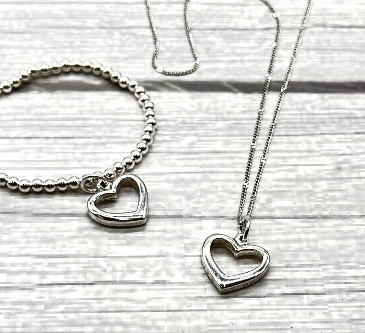 Silver floating heart on sale necklace