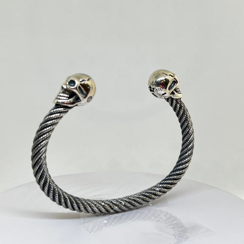 Heavy Sterling Silver Skull Bangle with a twisted design